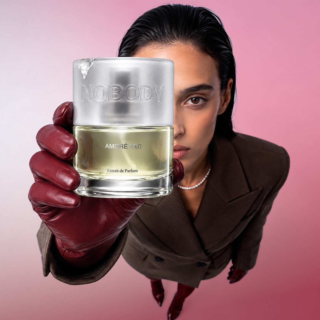 Close up of a model holding Amore Fati