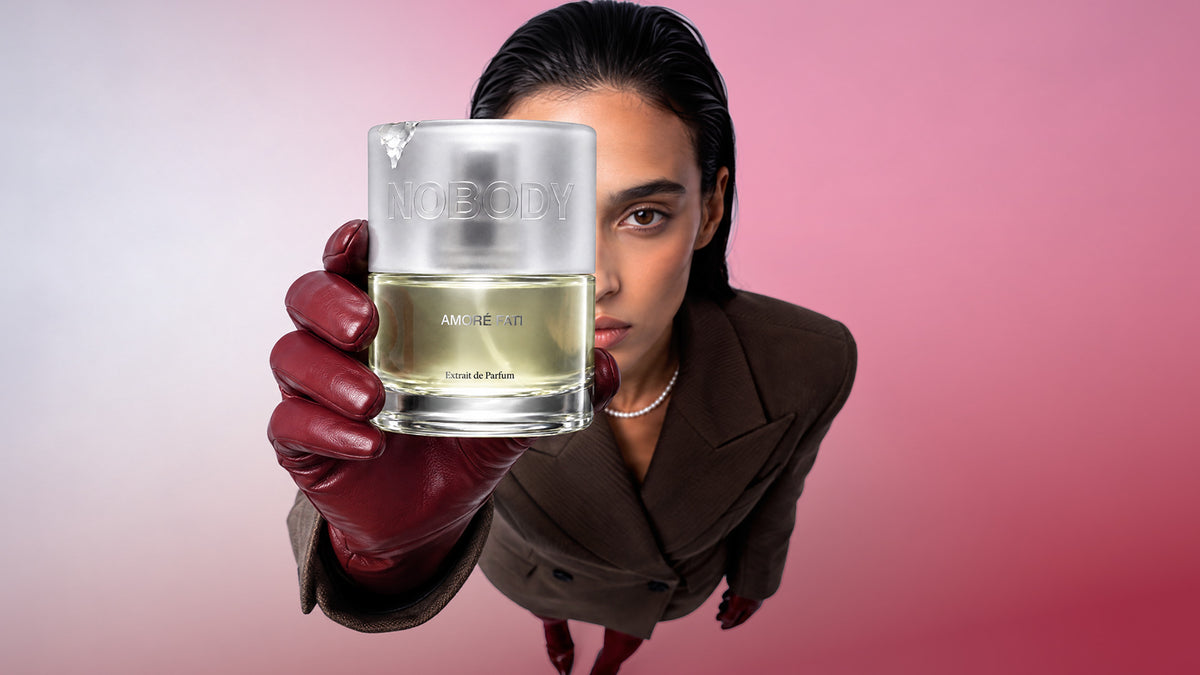Close up of a model holding Amore Fati