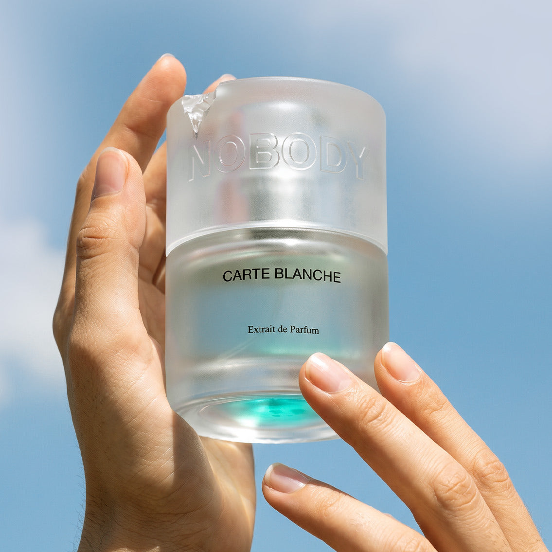 Carte Blanche held in hand