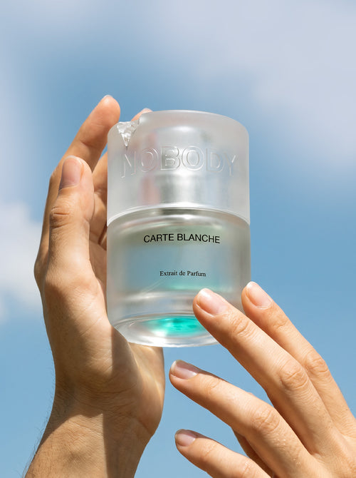 Carte Blanche held in hand