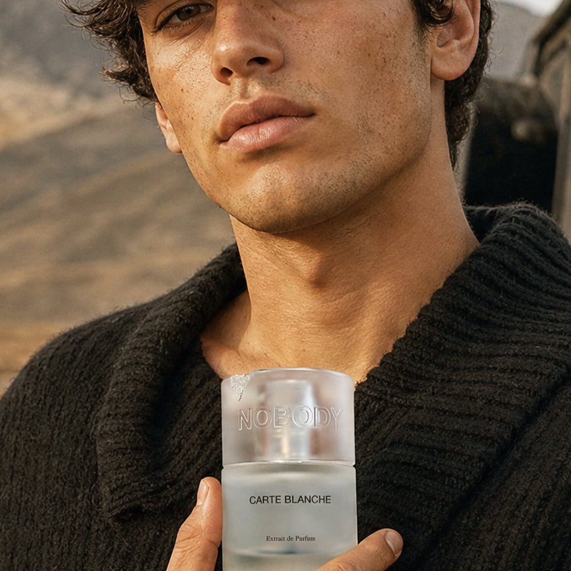 Close up of a model holding Carte Blanche