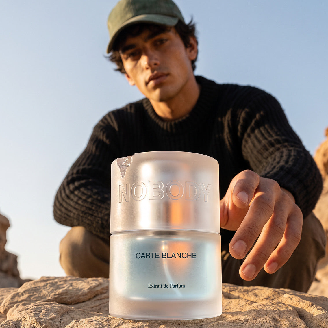 Model holding Carte Blanche