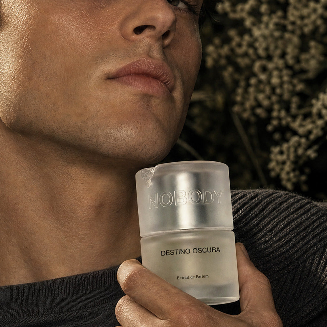 Close up of a model holding Destino Oscura